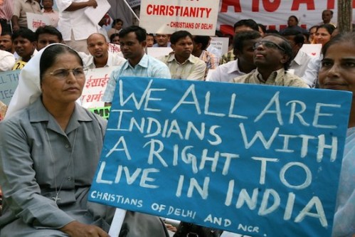 Indian Christians hold placards and banners during a protest in New Delhi on September 26, 2008, held to draw attention to continued anti-Christian violence in the southern Indian state of Karnataka and the eastern state of Orissa. Christian leaders in India have asked for the deployment of soliders in the restive states.   Some twelve people have died in Orissa's Kandhamai region and Karnatka since the death of Hindu Priest and Vishwa Hindu Parishad (VHP) leader Swami Lakshananananda Saraswait and four others who were shot dead by unidentified killers in Orissa in August. AFP PHOTO/RAVEENDRAN / AFP PHOTO / RAVEENDRAN